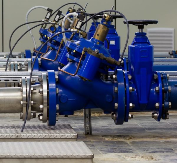Water pumping station with booster pumps and valves.